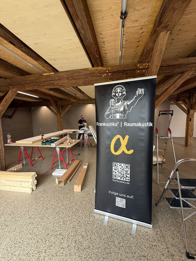Preparation for mounting room acoustics in a historic hall with a wooden beam ceiling